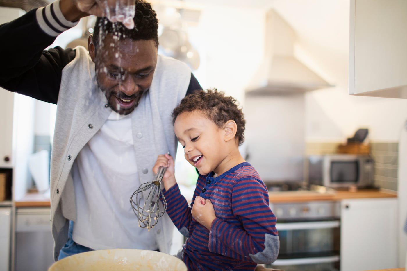 Father and son baking together
